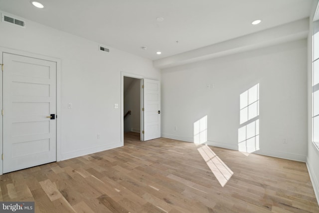 unfurnished room featuring light hardwood / wood-style floors