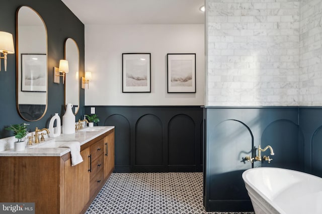 bathroom with a bathing tub and vanity