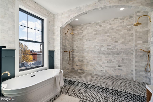 bathroom featuring tile patterned floors and plus walk in shower