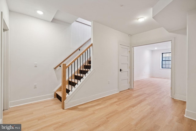 stairway with wood-type flooring