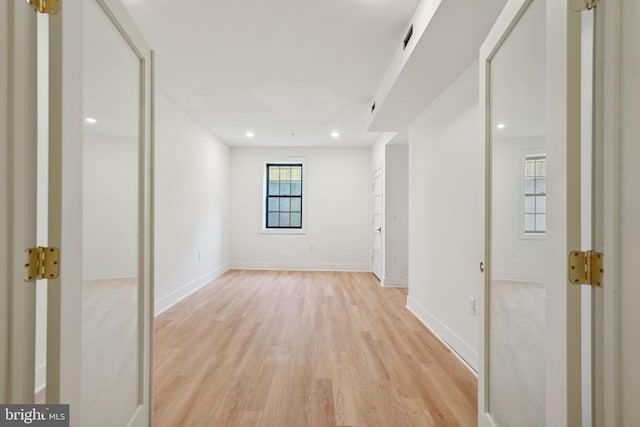 spare room featuring light hardwood / wood-style floors