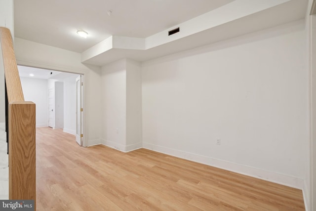 unfurnished room with light hardwood / wood-style flooring