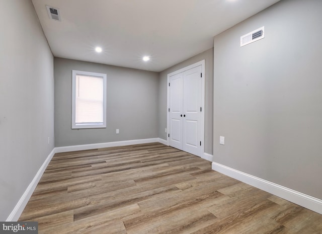 spare room featuring light wood-type flooring