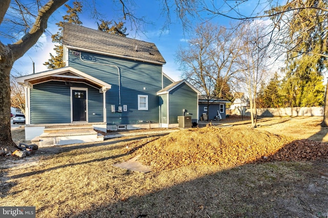 view of front property with central AC unit