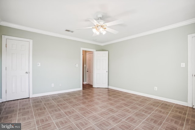 spare room with ceiling fan and ornamental molding