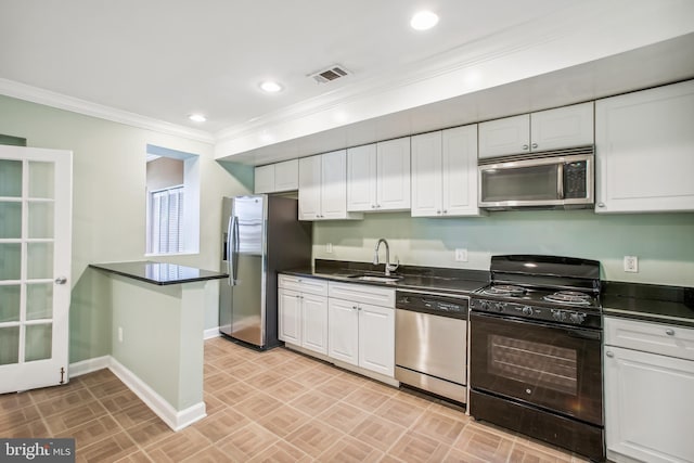 kitchen featuring white cabinets, crown molding, sink, and appliances with stainless steel finishes