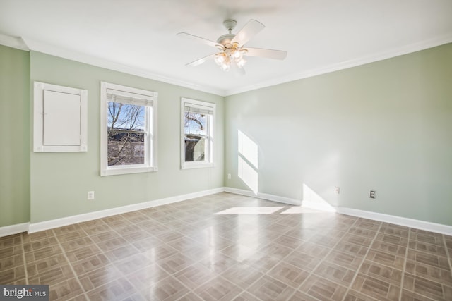 empty room featuring ceiling fan and ornamental molding