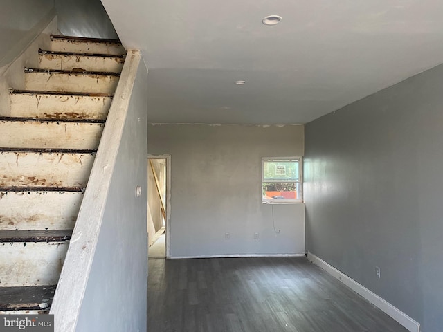 stairs with hardwood / wood-style flooring