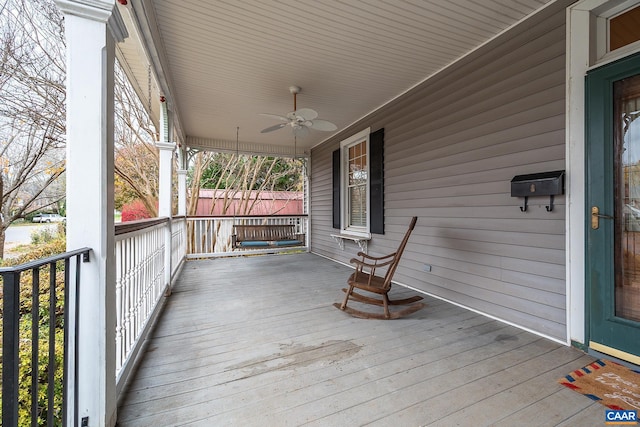 deck with ceiling fan and a porch