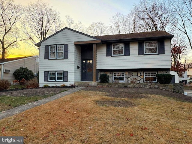 split foyer home with a yard