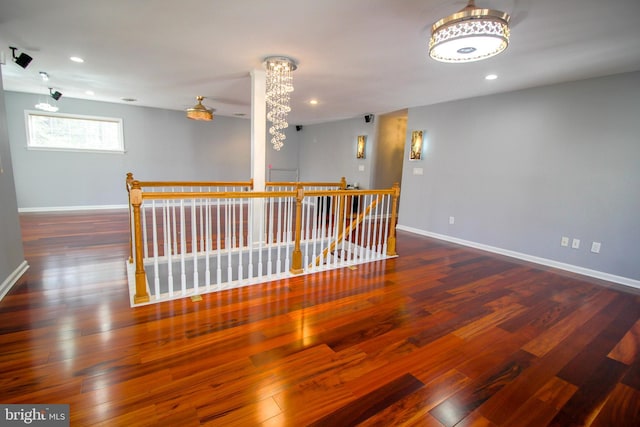 unfurnished room with dark wood-type flooring