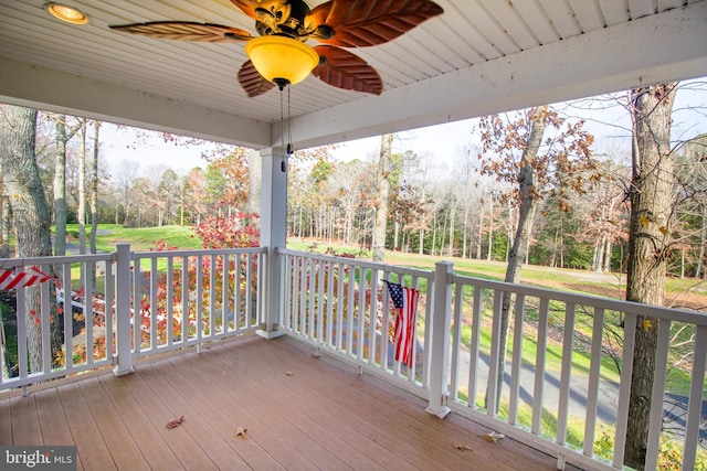 wooden deck featuring ceiling fan