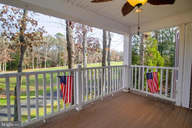 wooden deck featuring ceiling fan