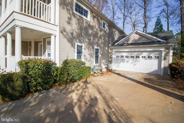 exterior space with a balcony and a garage