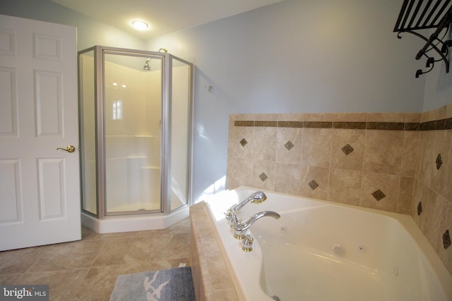 bathroom featuring plus walk in shower, tile patterned flooring, and lofted ceiling