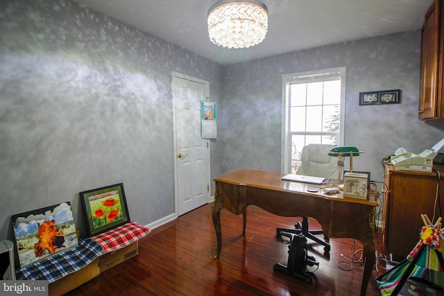 home office featuring a notable chandelier and dark hardwood / wood-style floors