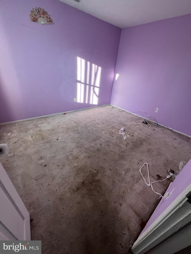 empty room featuring carpet flooring