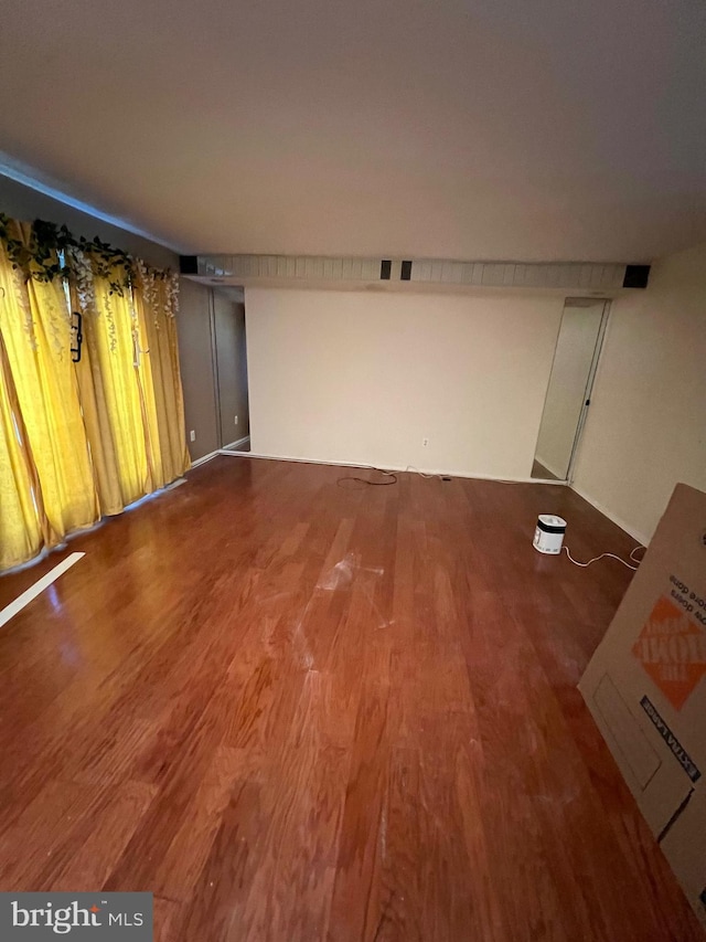 spare room with hardwood / wood-style flooring