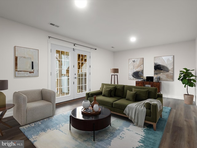 living room featuring french doors and dark hardwood / wood-style flooring