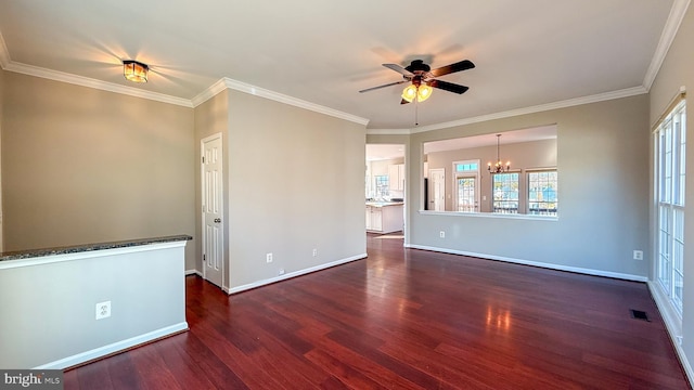 spare room featuring dark hardwood / wood-style flooring, crown molding, and ceiling fan with notable chandelier