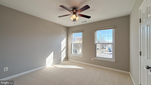 empty room with light carpet and ceiling fan