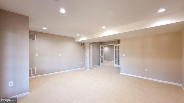 spare room with light colored carpet