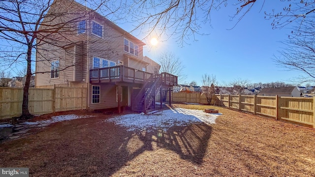 back of property featuring a wooden deck