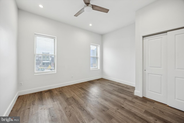 unfurnished bedroom featuring a closet, ceiling fan, and hardwood / wood-style flooring