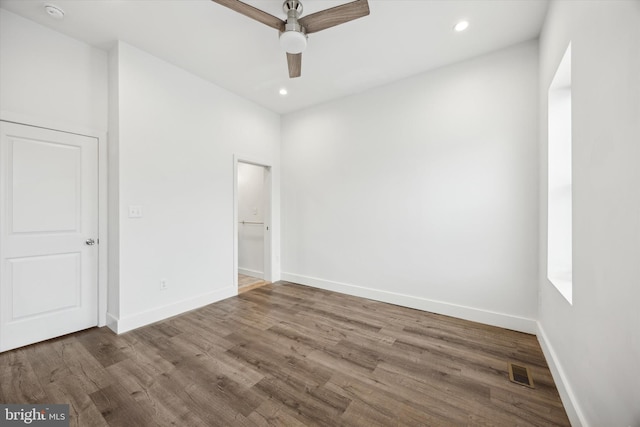 interior space with wood-type flooring and ceiling fan