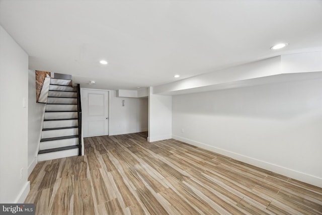 basement featuring light wood-type flooring