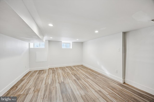 basement featuring light hardwood / wood-style flooring