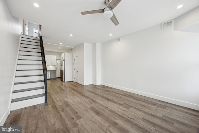 unfurnished living room with light hardwood / wood-style flooring and ceiling fan