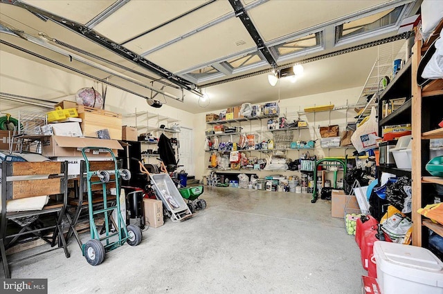 garage featuring a workshop area and a garage door opener