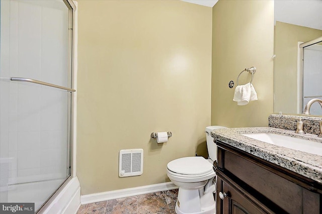 full bathroom featuring vanity, toilet, and enclosed tub / shower combo