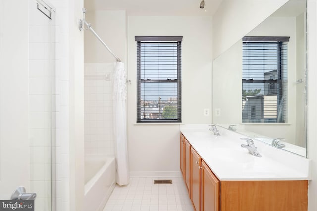 full bathroom featuring visible vents, a sink, baseboards, and tile patterned floors