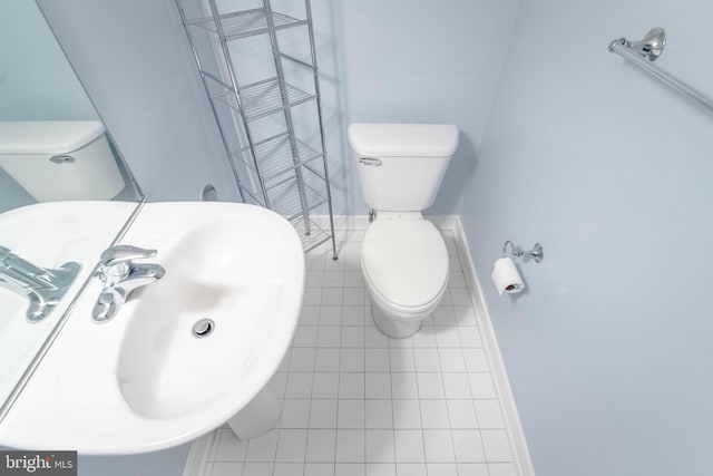 bathroom with toilet and a sink