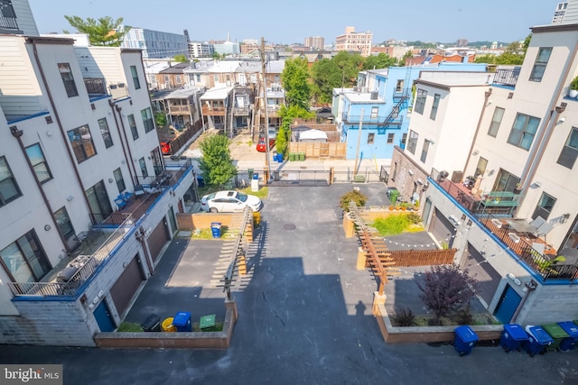 birds eye view of property featuring a city view