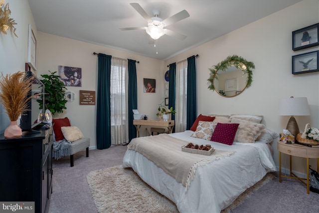 bedroom with light colored carpet and ceiling fan