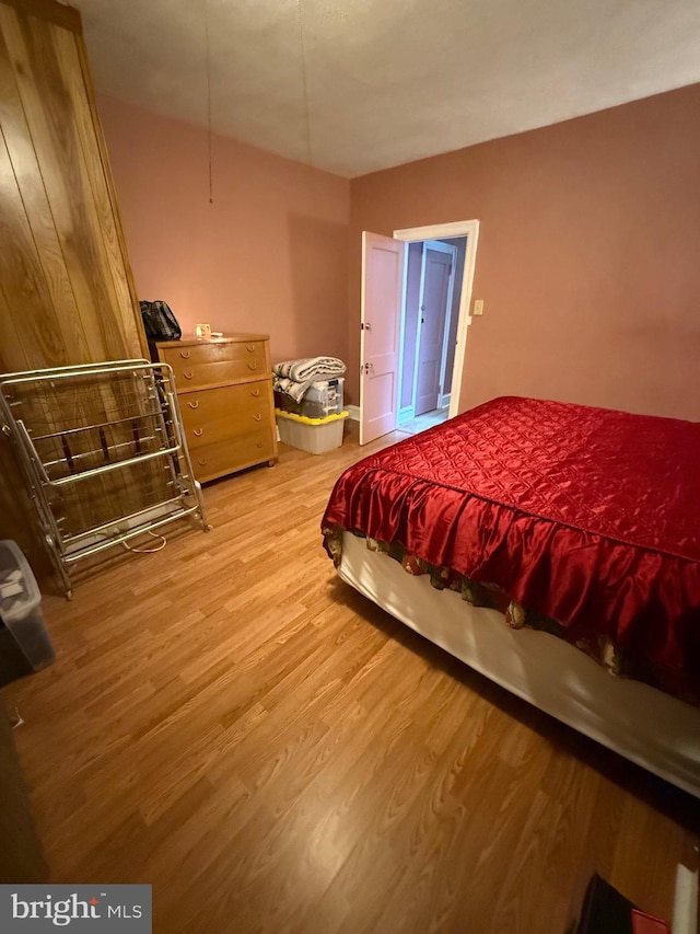 bedroom with light hardwood / wood-style floors