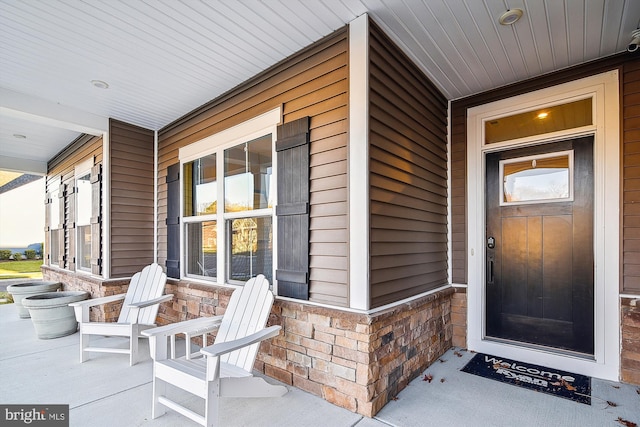 doorway to property featuring a porch