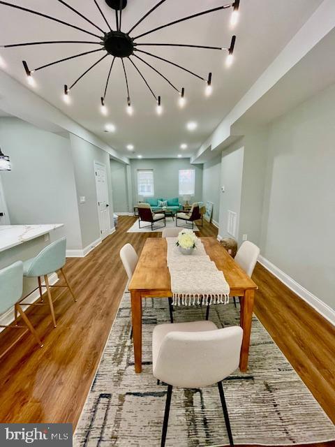 dining room with light hardwood / wood-style floors