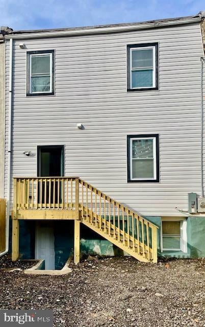 rear view of house featuring a deck