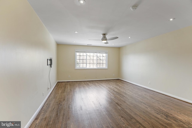 empty room with hardwood / wood-style flooring and ceiling fan