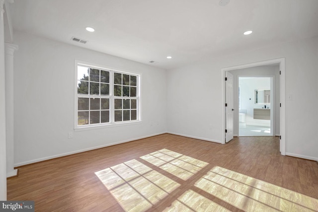 empty room featuring wood-type flooring