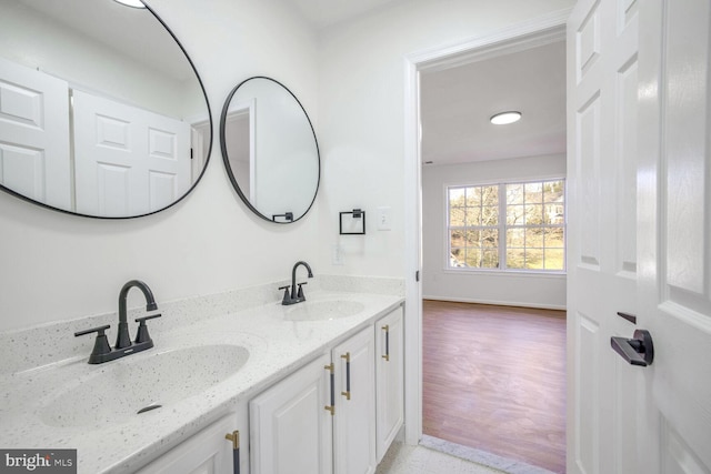 bathroom with hardwood / wood-style floors and vanity