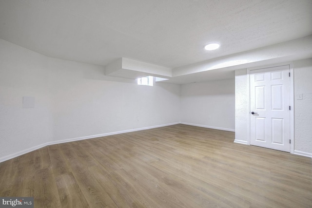 basement with light wood-type flooring