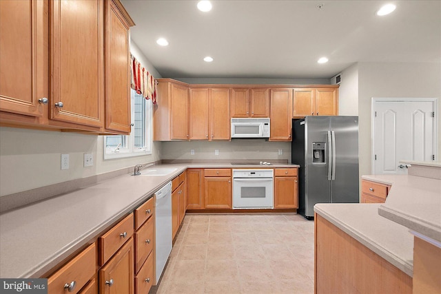 kitchen with white appliances and sink