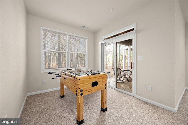 recreation room with carpet flooring