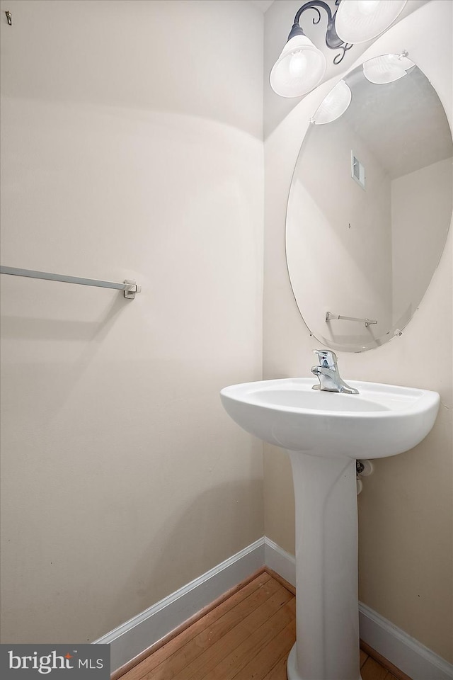 bathroom featuring sink and hardwood / wood-style flooring