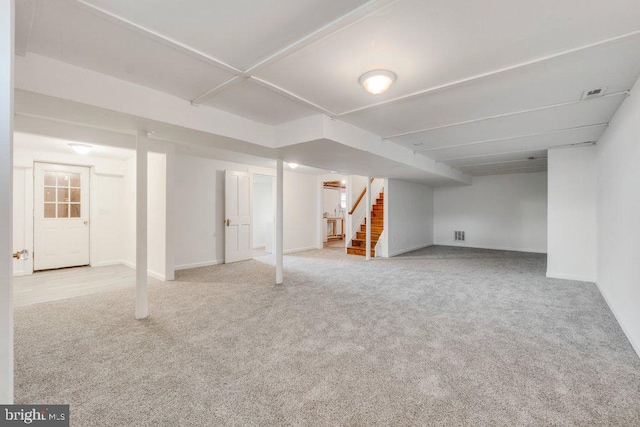 basement with light carpet